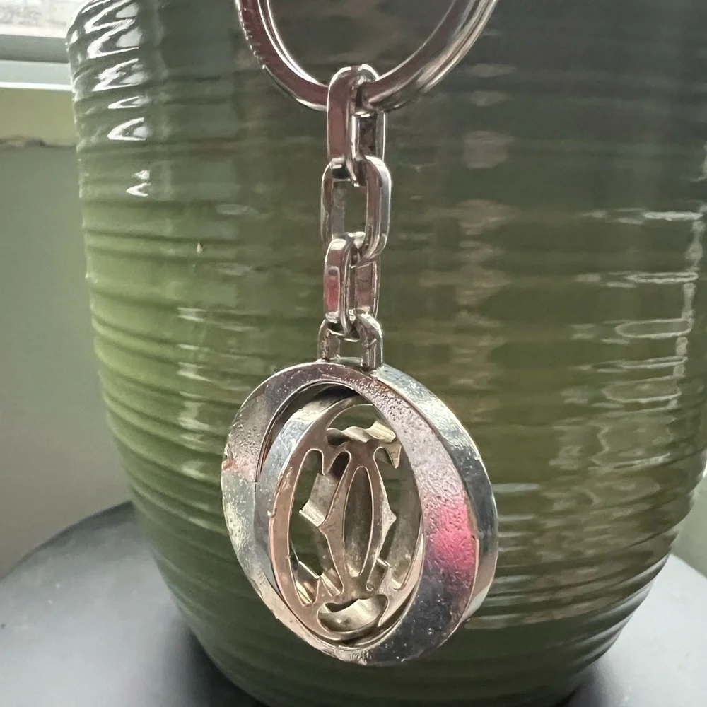 Cartier Silvertone stainless steel pivoting Double C key ring